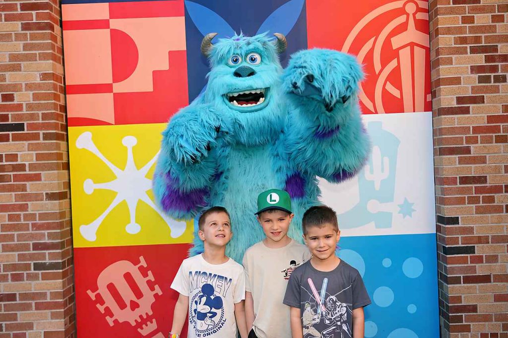Danielle's three sons posing with Sulley from Monsters, Inc. at Disney's Hollywood Studios.